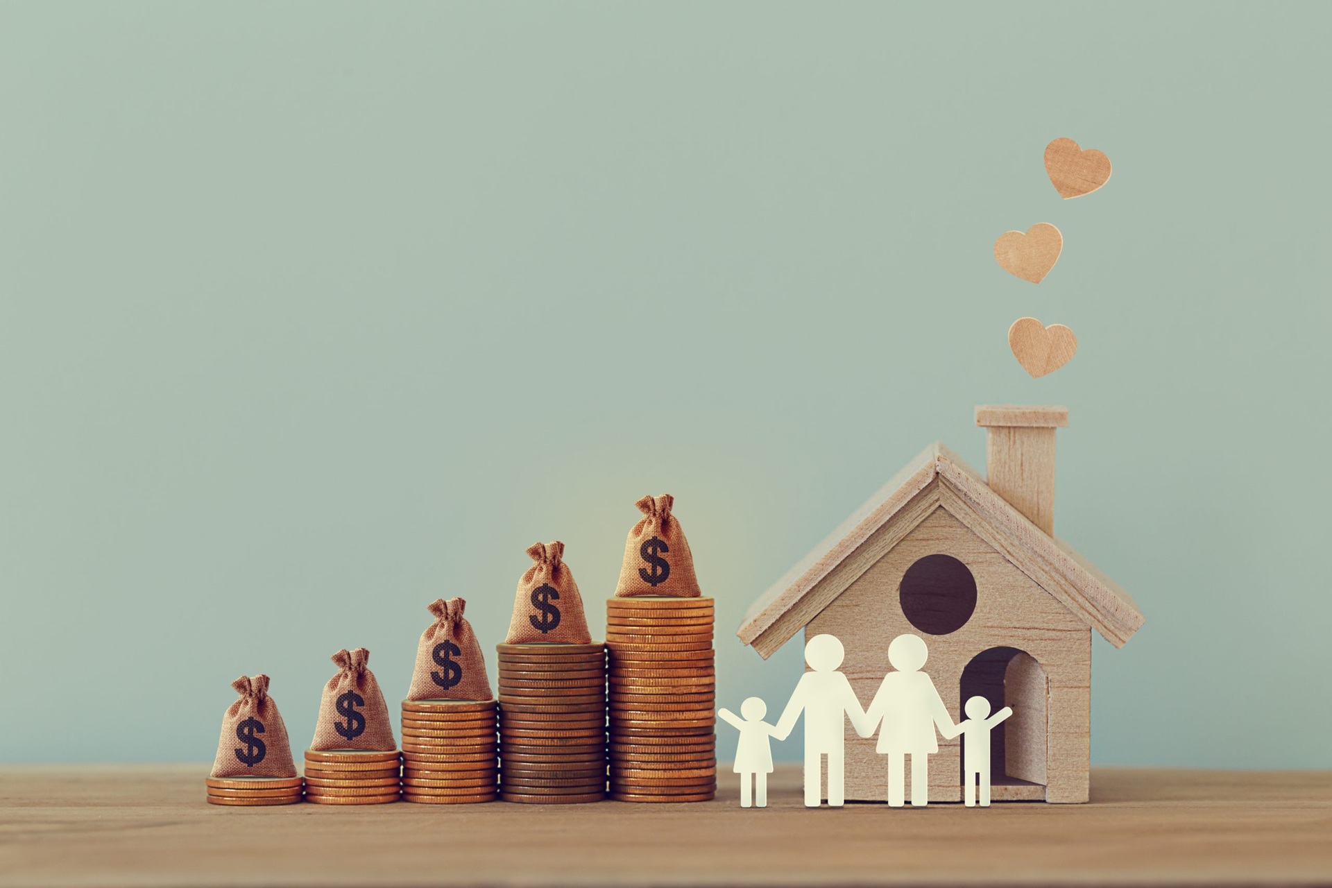 Mini house and heart family members and money bags